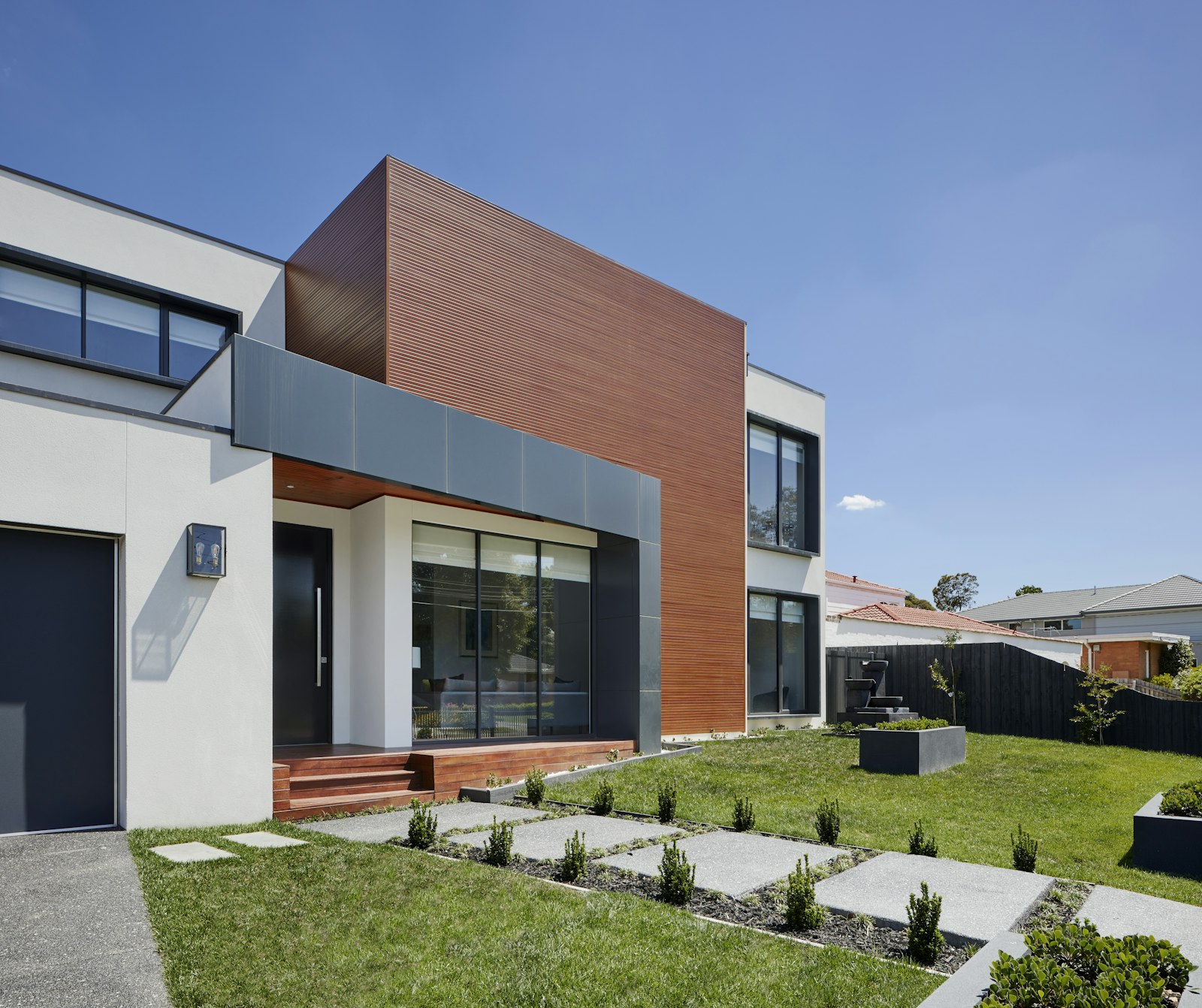 Residential home exterior with landscaping and driveway