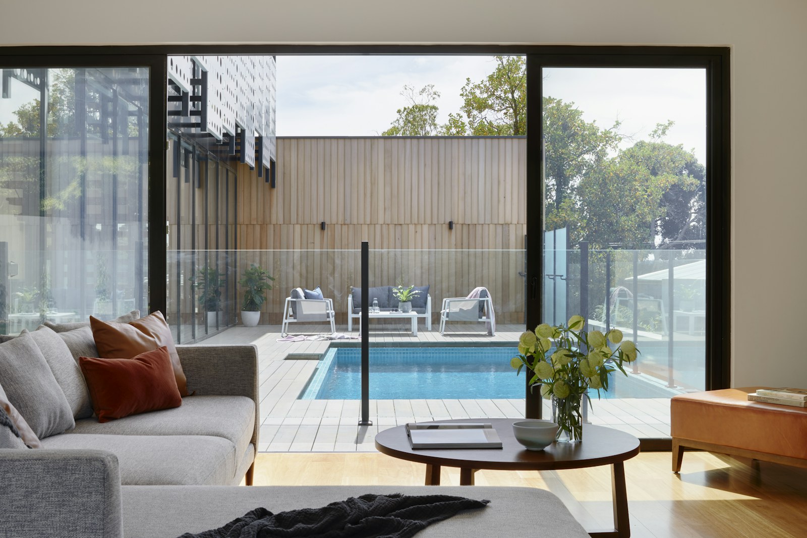 Bright interior room with large windows and clean staging